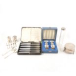 A collection of small silver items, including salt and pepper set, toast rack, flatware etc.
