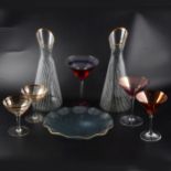 A large number of vintage cocktail glasses.