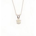 A diamond solitaire pendant and chain.
