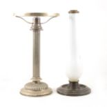 Hukin and Heath, a silver plated table candle lamp with reeded column, lacking shade. Height 32cms.