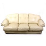 A pair of contemporary cream coloured leather three-seat sofa