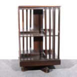 An Edwardian stained oak revolving bookcase,