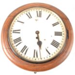 An oak cased wall clock