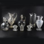 A small number of glass decanters and other glassware