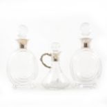 A pair of French Vannes crystal decanters, with stoppers, silver collars, 24cm; cut-glass ship's