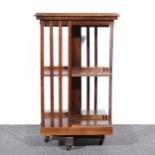 An Edwardian style inlaid mahogany revolving bookcase