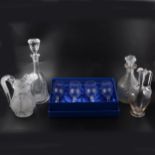 A quantity of cut crystal glass decanters, jugs, and stemware.