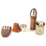 A small collection of stirrup cups and canteens in leather holders.