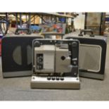 Bell & Howell Filmosound TQI 16mm projector, with a pair of Bell & Howell speakers in carry cases.