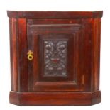 A Victorian mahogany corner cupboard