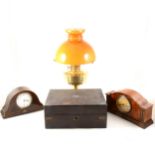 An Edwardian mantel clock, a walnut cased mantel clock, brass oil lamp, and writing box
