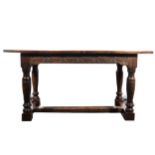 An oak dining table, rectangular boarded top