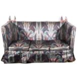 A knoll type settee, Art Nouveau style cotton print loose covers