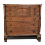 A large mahogany chest of drawers,