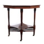 An Edwardian walnut octagonal window table