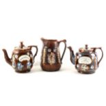 Three items of Bargeware, including two teapots and a jug