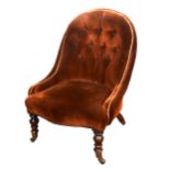 A small Victorian nursing chair, upholstered in buttoned chocolate brown dralon, turned walnut