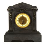 A Victorian black and veined marble mantel clock