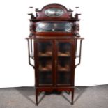 A late Victorian stained walnut display cabinet, superstructure with two mirrored panels, and