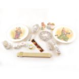 A slide rule, metal rule, silver four piece dressing table set, two Beatrix Potter figures