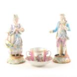 A Pair of German porcelain figures, and a Dresden cup and saucer.