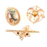 Three vintage gold brooches.