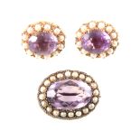 An amethyst and seed pearl oval brooch and pair of similar earrings for pierced ears.