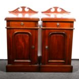 A pair of Victorian style mahogany bedside pedestals, raised backs, each with a single drawer over a