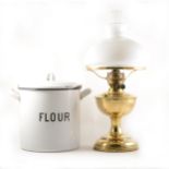 A vintage enamel flour bin, and a brass oil lamp