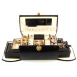 A jewel box containing silver and costume jewellery.