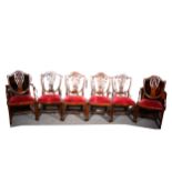 A set of six Hepplewhite style mahogany dining chairs, shield-shape backs, drop-in seats, comprising