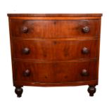 A Victorian mahogany bowfront chest of drawers, fitted with three drawers, turned legs, width