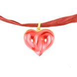 Lalique - A "Coeurs Entrelacs" red glass entwined double heart pendant,
