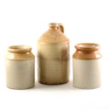 A stoneware chemist's flagon and two stoneware containers.
