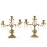 A pair of contemporary patinated metal three-light candelabra