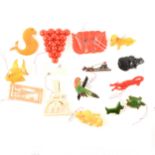 Fifteen vintage celluloid/bakelite/plastic novelty brooches and clips.