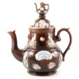 A large bargeware teapot, inscribed and dated 1906