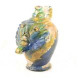 A continental blue, green and yellow lead glazed pitcher in the style of a bellarmine
