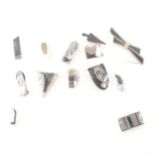 Twelve bakelite and early plastic Art Deco black dress clips and brooches.