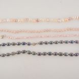 A collection of pearl necklaces and bracelet.