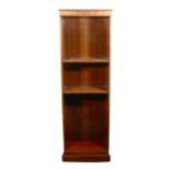 A reproduction mahogany open bookcase