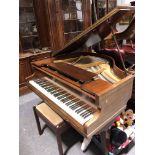 A German sapele cased baby grand piano, Schubach, iron framed and overstrung, three square
