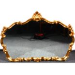 A reproduction gilt composition cartouche shape wall mirror, scrolled outlines, 86cm x 125cm.