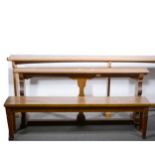 An oak altar rail, chamfered stretcher, divided in three, length 396cm; a similar smaller rail, with