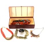 A collection of costume jewellery bead necklaces and earrings.