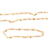 A 9 carat yellow gold necklace and bracelet suite.