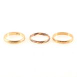 Three 9 carat gold wedding bands.