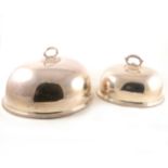 Two silver-plated oval meat covers.