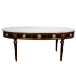 A reproduction coffee table, oval marble top, the frieze with brass appliques and inset roundels,