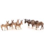 Seven Beswick donkey figurines